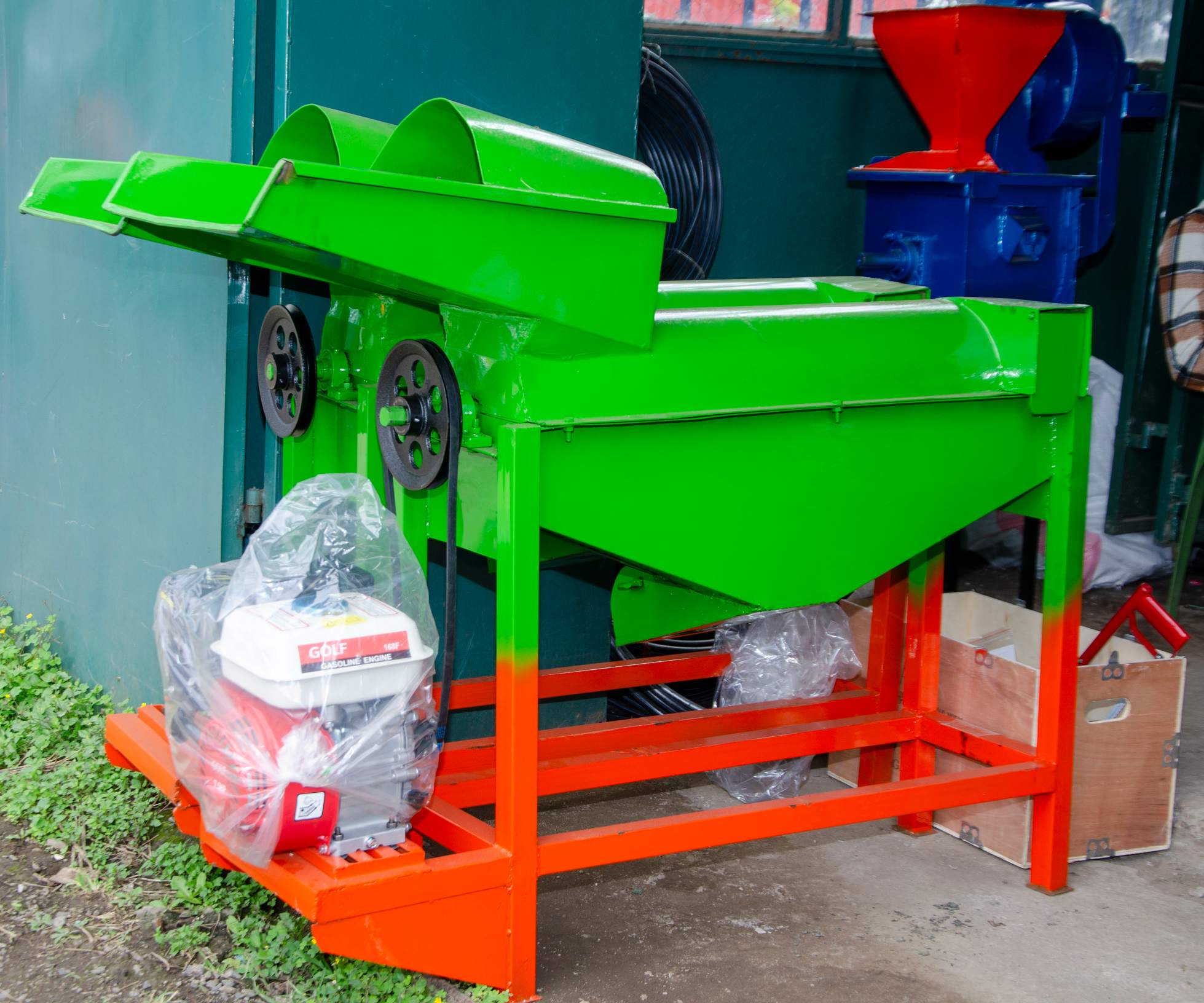 Imported feed chopper in Kenya with a petrol engine newly mounted on a locally built frame